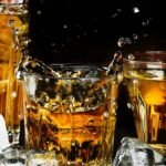 alcohol bar black background close up - Can I drink alcohol on a keto diet?