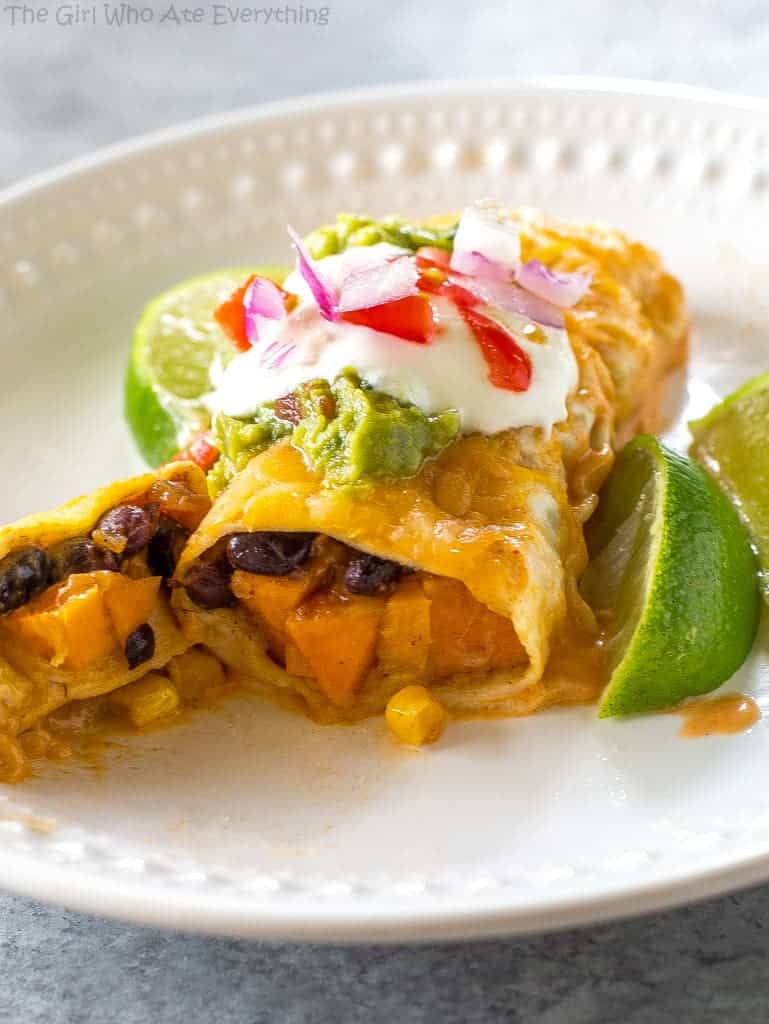 Sweet Potato and Black Bean Enchiladas - a vegetarian Mexican dinner that has the perfect amount of spice and flavor. This is a great freezer meal! #sweet #potato #black #bean #enchiladas #mexican #dinner