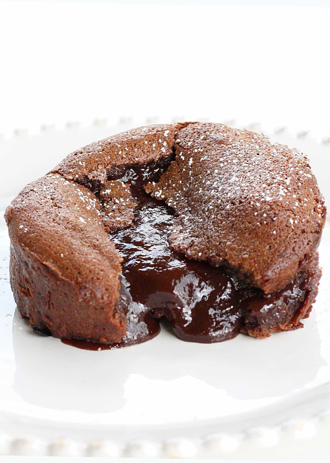 Roy's Chocolate Souffle (Molten Lava Cakes) - a gooey chocolate center is a surprise in the middle! A chocolate lover's dream. Not a copycat recipe. The actual recipe from Roy's. the-girl-who-ate-everything.com