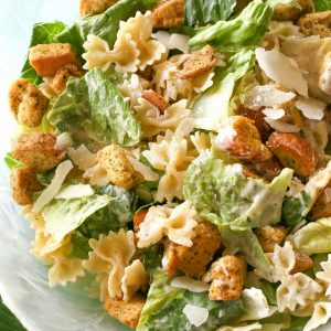 Bowtie Chicken Caesar Salad - a great way to bulk up a salad is to add cooked pasta to it! Try it and you'll never go back. the-girl-who-ate-everything.com