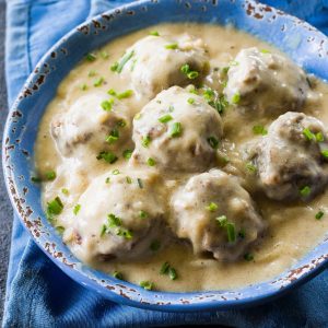Swedish Meatballs - so tender with a flavorful gravy. Serve over noodles or rice. the-girl-who-ate-everything.com
