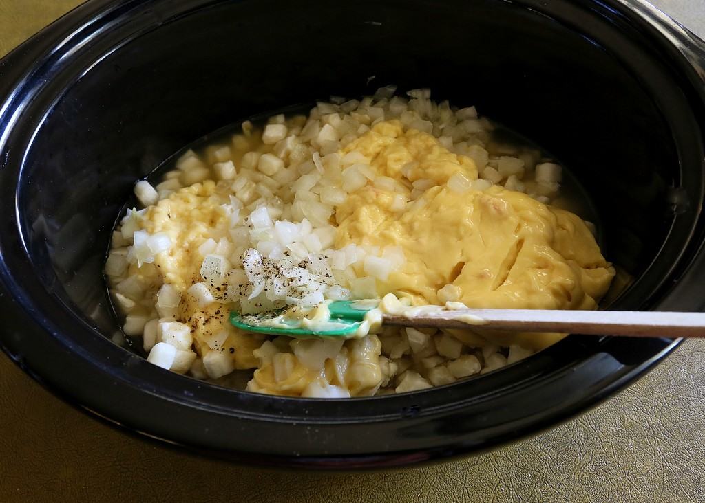 potatoes and onion in a slow cooker