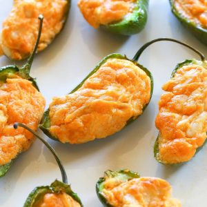 Buffalo Chicken Jalapeno Poppers - buffalo chicken dip meets jalapenos! Game food right here. the-girl-who-ate-everything.com