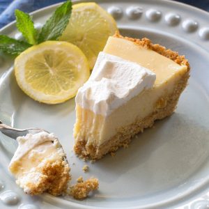 Magnolia's Lemon Pie - light, sweet and tart lemon pie with a thick graham cracker crust. From Joanna Gaines! the-girl-who-ate-everything.com