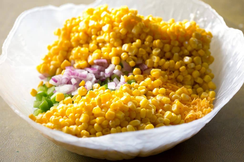 Frito Corn Salad - this is your game day recipe. Corn, Fritos, peppers, and onion. So good!