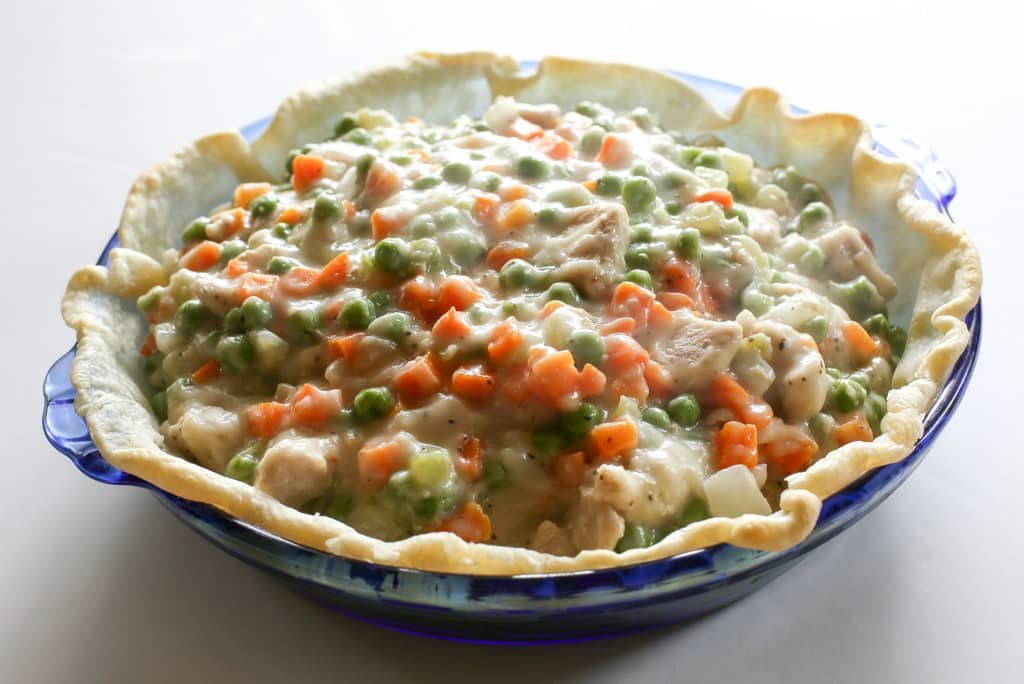 pie crust filled with carrots and peas