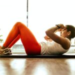 woman exercising indoors stockpack unsplash scaled - Tips for Improving General Health