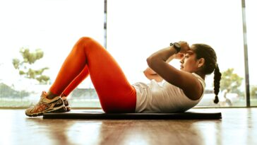 woman exercising indoors stockpack unsplash scaled - Tips for Improving General Health