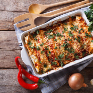 Mexican enchilada in a baking dish horizontal top view