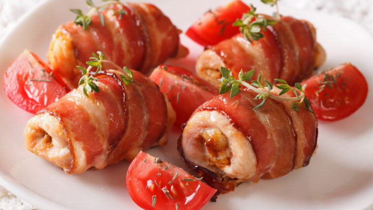 Stuffed chicken breast wrapped in bacon close-up. horizontal