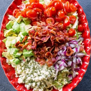 Brussels Sprouts Salad - shaved Brussels sprouts with bacon, onion, tomato, avocado, and gorgonzola cheese. the-girl-who-ate-everything.com