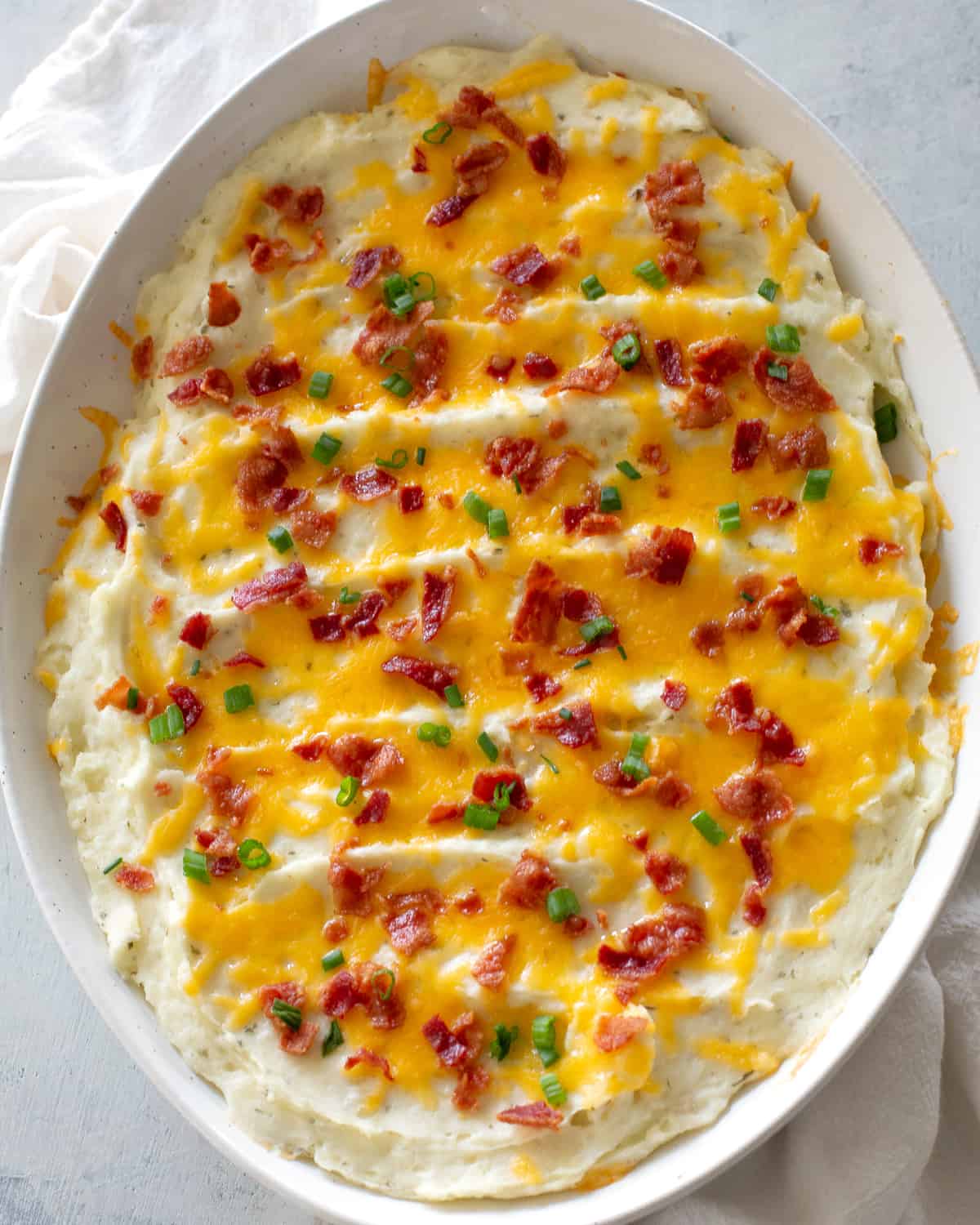 potatoes with cheese, bacon, and green onions