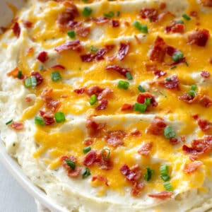 potatoes with cheese, bacon, and green onions