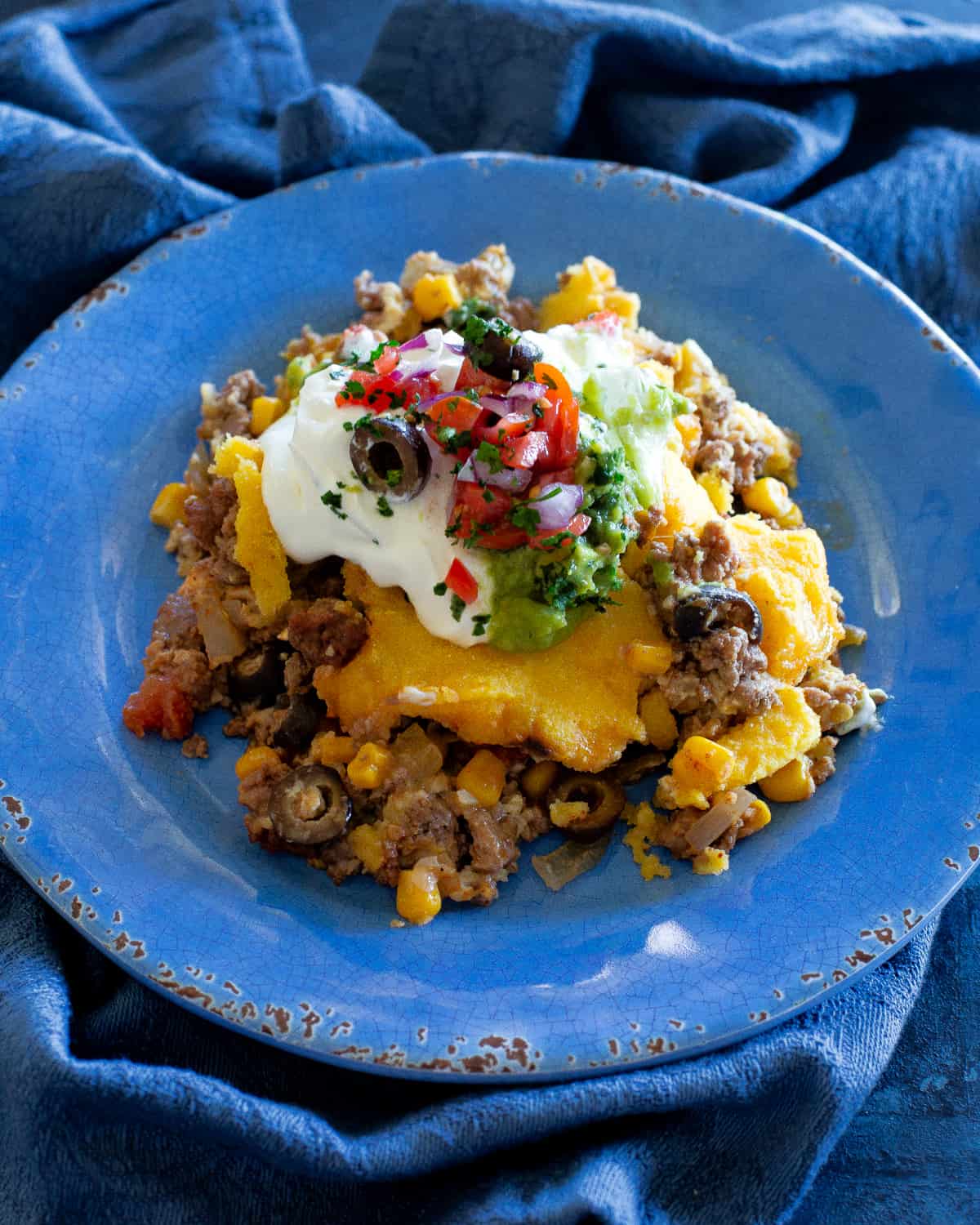 tamale pie on a blue plate